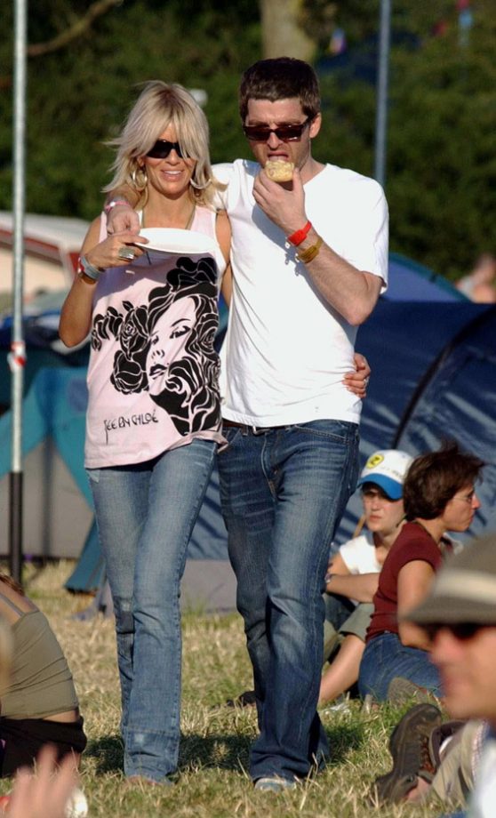 Noel Gallagher And Sara MCdonald Relax At Glastonbury 2003