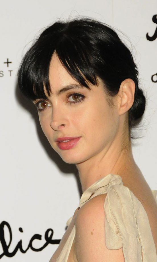 Krysten Ritter Updates The Simple Ballet Bun Hairstyle With A Choppy Fringe, 2011