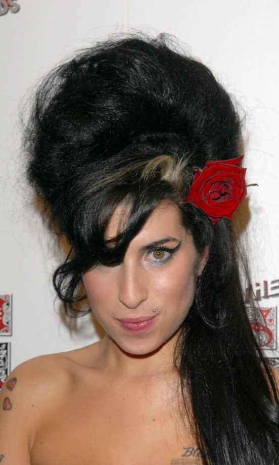 Amy Winehouse Spruces Up Her Trademark Beehive Hairstyle With A Red Flower, 2007