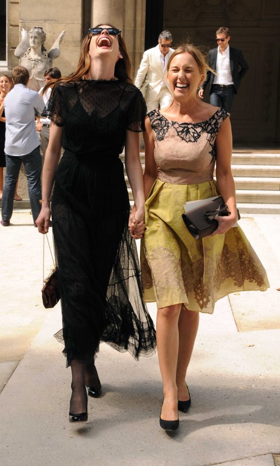 Anne Hathaway And Friend Are All Smiles On The Way To The Valentino Haute Couture AW11/12 Fashion Show