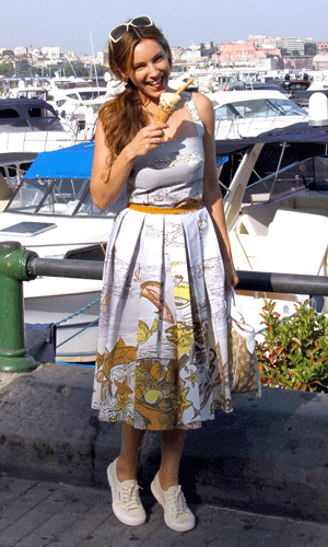 Kelly Brook shows off a gorgeous summer look with a printed sundress and Supergra trainers in Italy