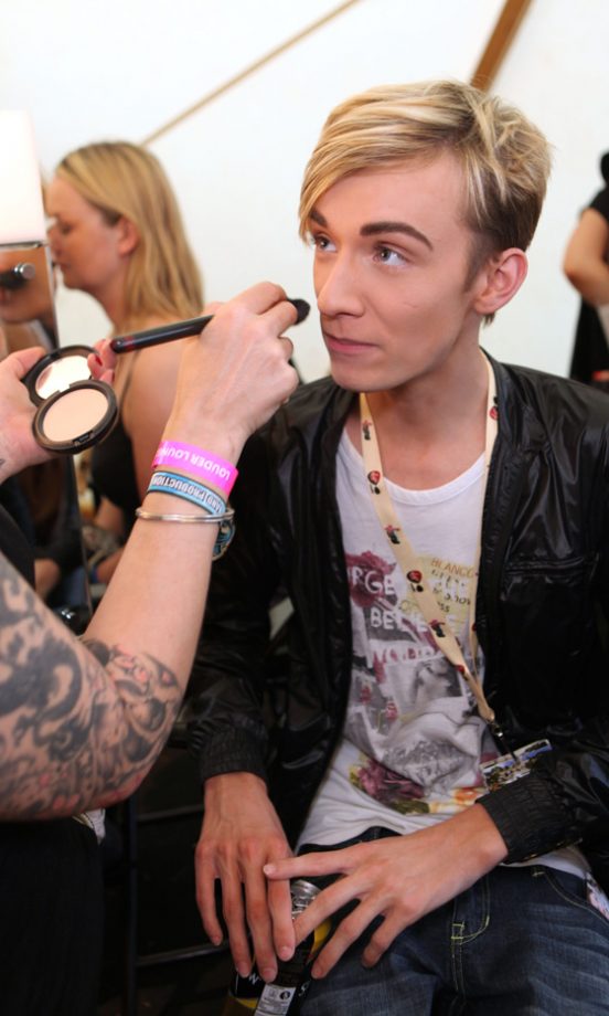 Harry Derbidge Touches Up His Make-Up In The MAC Tent At The Virgin Media Louder Lounge, V Festival 2011
