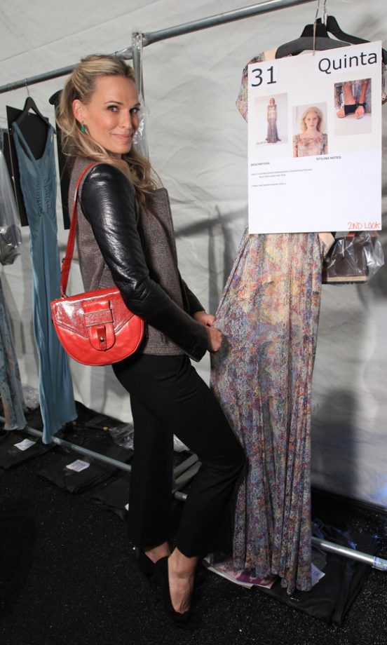 Molly Sims Checks Out The Clothes Backstage At The Rebecca Minkoff Spring/Summer 2012 Fashion Show