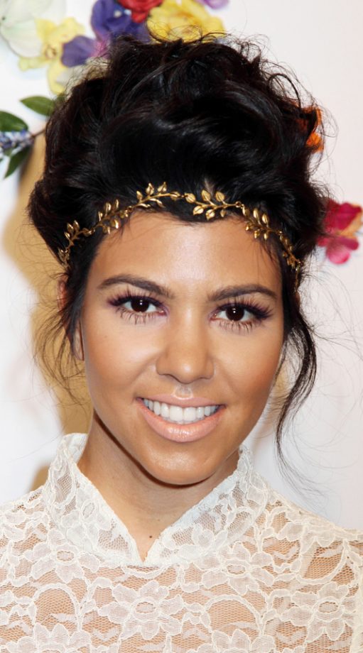 Kourtney Kardashian Accessorizes Her Beehive Hairstyle With A Floral Headband, 2011