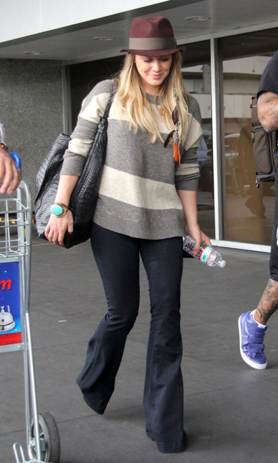 Hilary Duff Covers Up Her Baby Bump With On Trend Flared Jeans And A Trilby Hat, 2011