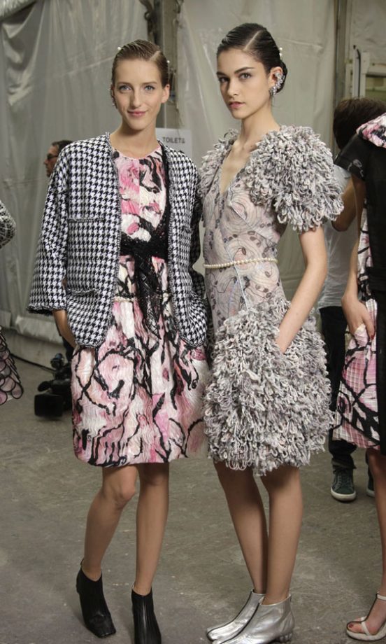 Models Wait Backstage At Chanel's SS12 Fashion Show At Paris Fashion Week