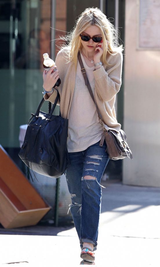 Dakota Fanning Does Off-Duty Chic In Distressed Jeans And Slouchy Cardigan, 2011