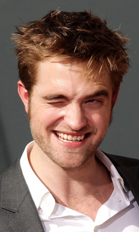 Robert Pattinson Strikes His Best Pose For The Cameras At The Twilight Hand And Foot Print Ceremony, 2011