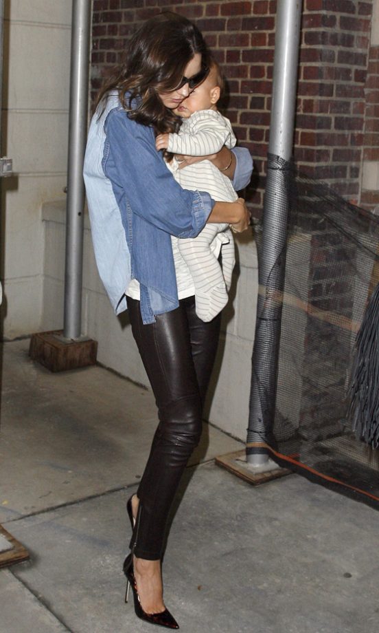 Model Mum: Miranda Kerr Takes A Turn To Cuddle Flynn Bloom, 2011