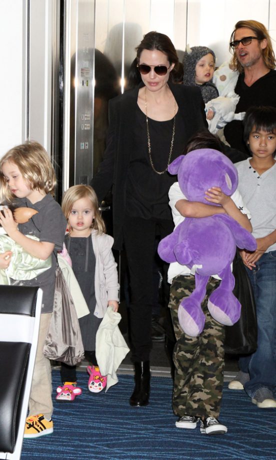 Angelina Jolie And Brad Pitt Lead Their Jet-Setting Children Through The Airport As They Leave Japan, 2011