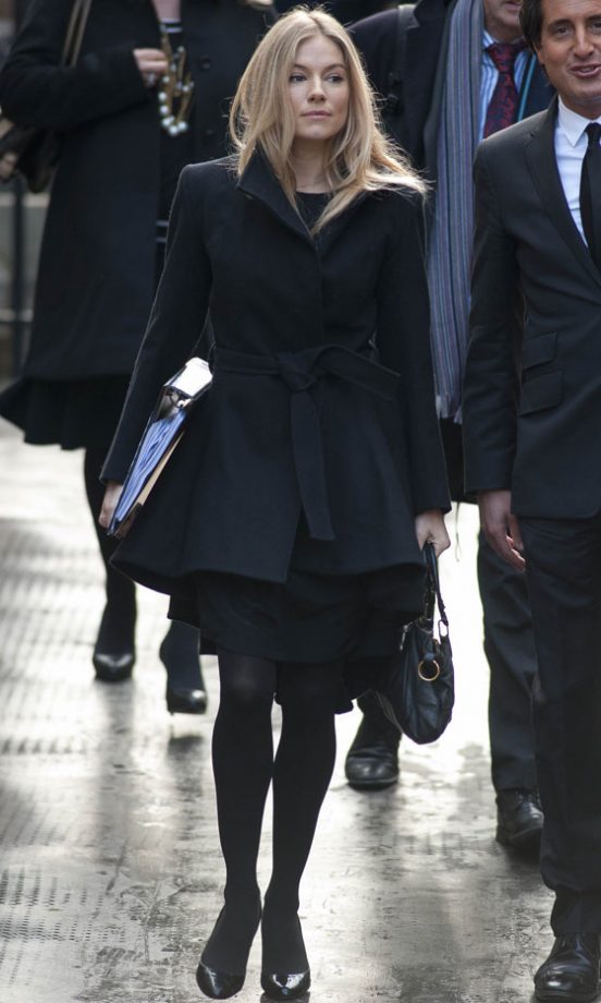 Sienna Miller Ditched Her Usual Boho Style For A Sleek Black Coat While Out In London. 2011
