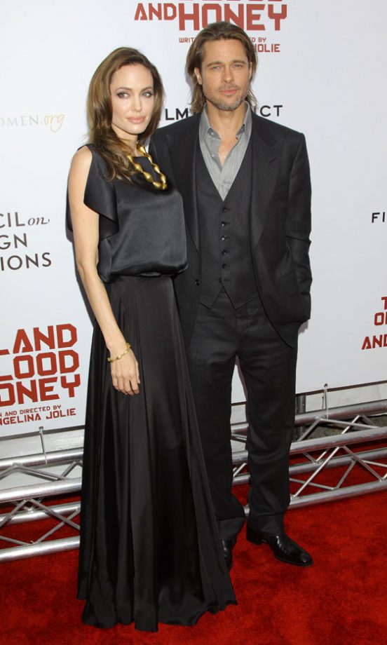 Angelina Jolie And Brad Pitt At The Premiere Of In The Land Of Blood And Honey - Love That Statement Necklace. 2011