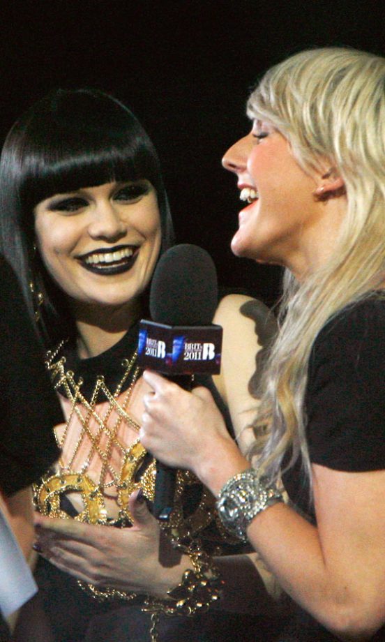 Jessie J Has A Giggle With Ellie Goulding Backstage At The Brit Awards, 2011