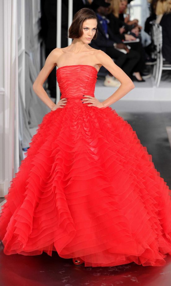 Red Hit: Model At The Dior Haute Couture Fashion Show SS12