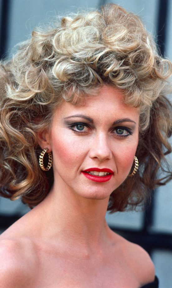Olivia Newton-John Sassed Up Her Look As Sandy In Grease With Red Lipstick And A Poodle Perm