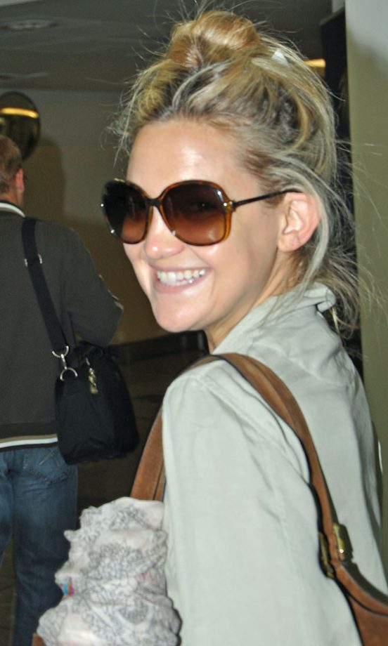 Kate Hudson Looks Excitable As She Heads Off To Tokyo In Over Sized Sunnies, 2010