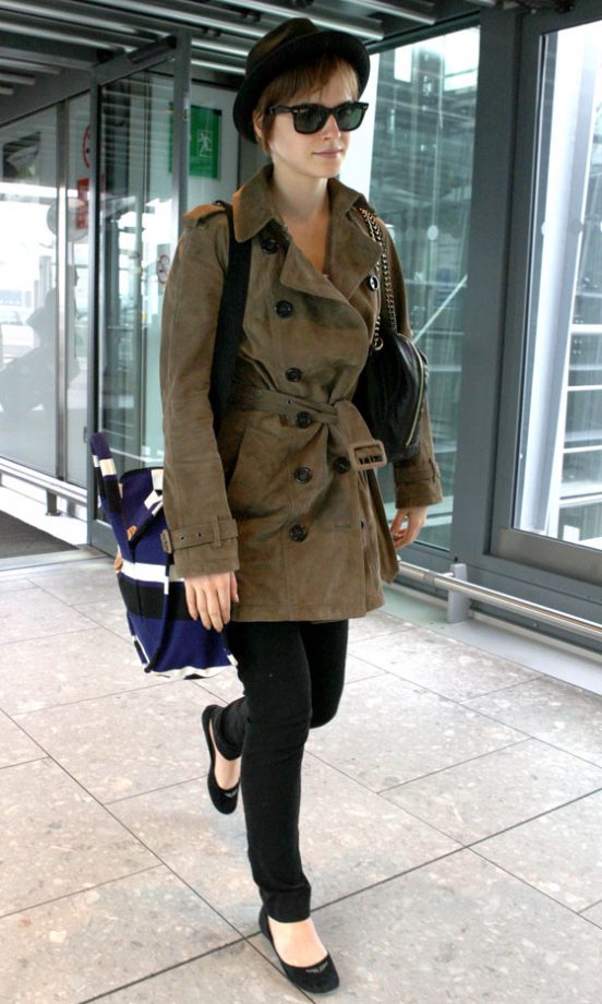 Emma Watson Works A Burberry Trench Coat As She Jets Back To Britain, 2011
