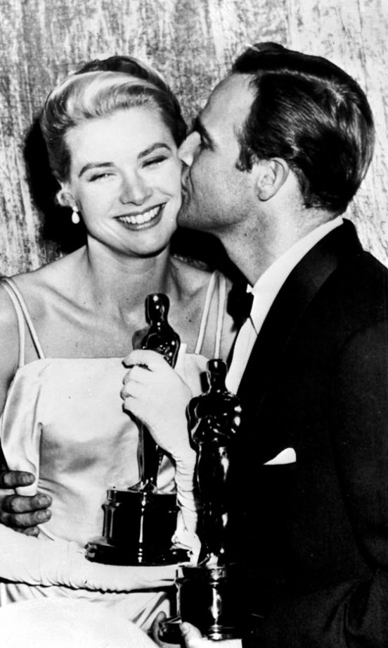 Grace Kelly Holds Her Best Actress Award For Country Girl, With Marlon Brando At The 1954 Academy Awards