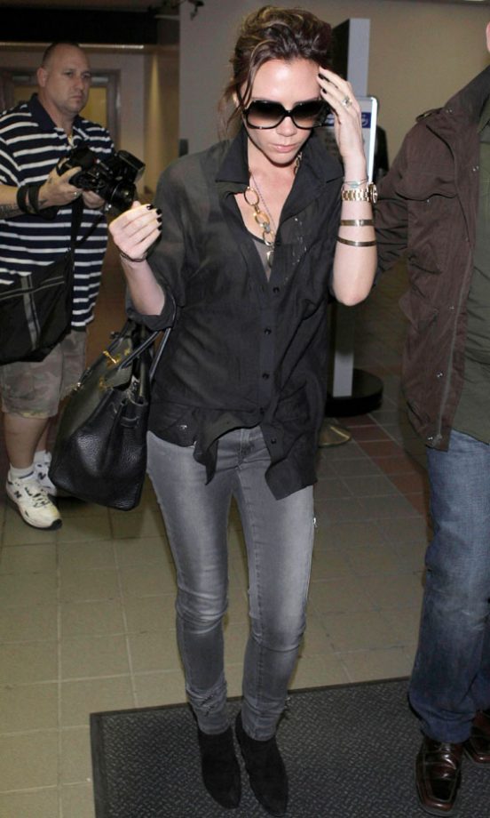 Victoria Beckham Arrives At LAX In Her Trademark Shades, March 2010