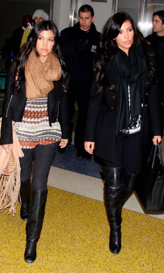 Sister Act: Kourtney Kardashian And Kim Kardashian Arrive At JFK, January 2011