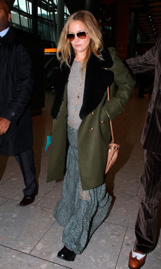 Kate Hudson Arrives At Heathrow Airport Rocking This Season's '70s Trend In An Oversized Coat And Maxi Skirt, January 2011