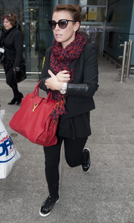 Coleen Rooney Arrived At Heathrow Airport Carrying A Huge YSL Bag, 2012
