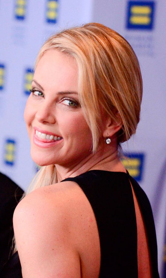 Charlize Theron Smiles For The Cameras, March 2012