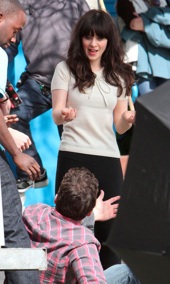 Zooey Deschanel Larks Around With Cast Members On The Set Of New Girl. 2012