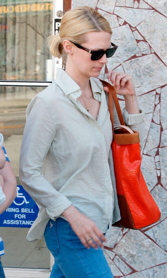 January Jones Keeps Her Downtime Look Fun With A Tangerine Bag, 2012