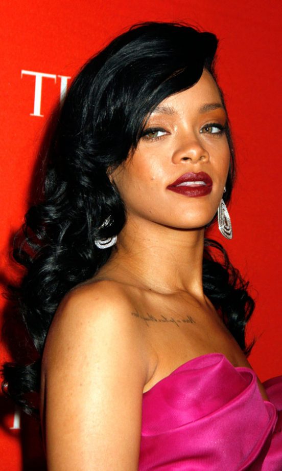 Rihanna Looks Ever Inch The Superstar With Flowing Curls, A Red Lip And Sparkling Earrings, 2012