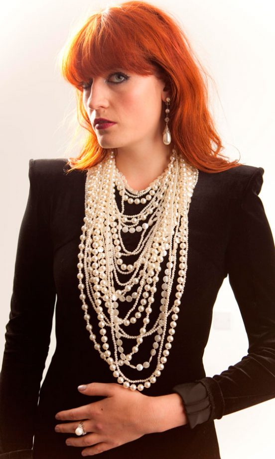 Florence Welch Wearing A Black Sharp-Shouldered Top And Pearls, June 2009
