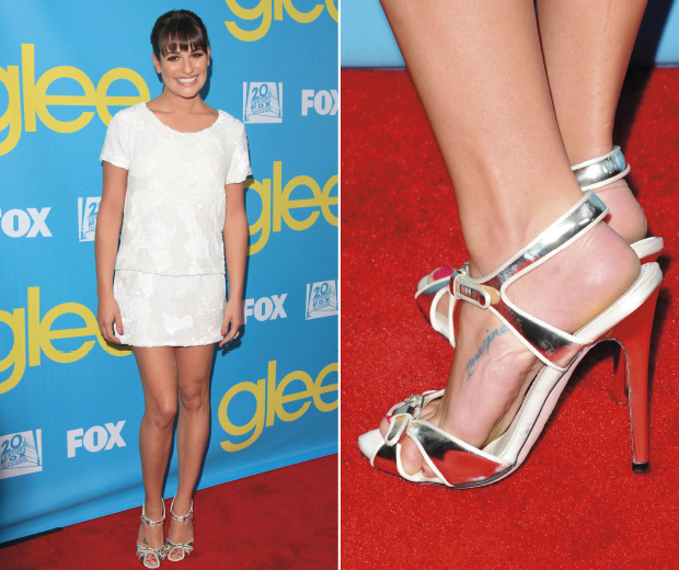 Lea Michele wearing a white shift dress with silver metallic shoes on the red carpet