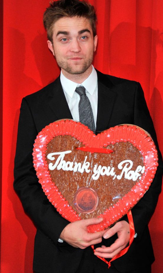 Robert Pattinson Accepted A Heart At The Twilight Saga: Breaking Dawn: Part 1 Film Premiere In Berlin, 2011