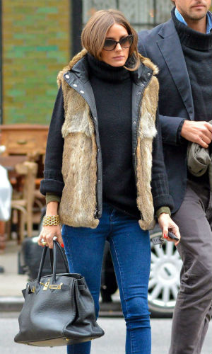Olivia Palermo wraps up in a stylish gilet and jeans in New York