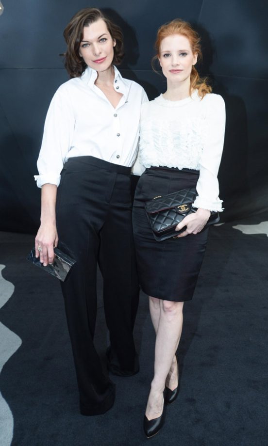 Milla Jovovich And Jessica Chastain At The Chanel AW13 Show At Paris Fashion Week, 2013