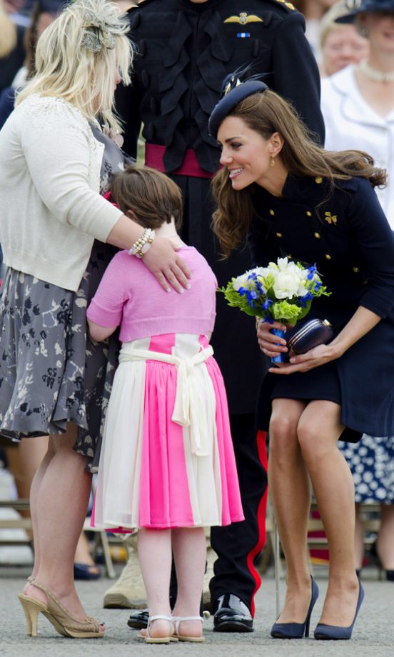 Kate Middleton, Duchess Of Cambridge, With A Child At The Barracks In Windsor, 2011