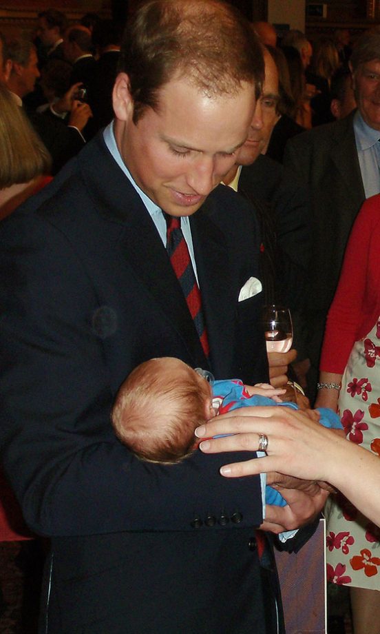 Prince William Holding A Bay At The South Pole Reception At Goldsmiths Hall In London, 2012