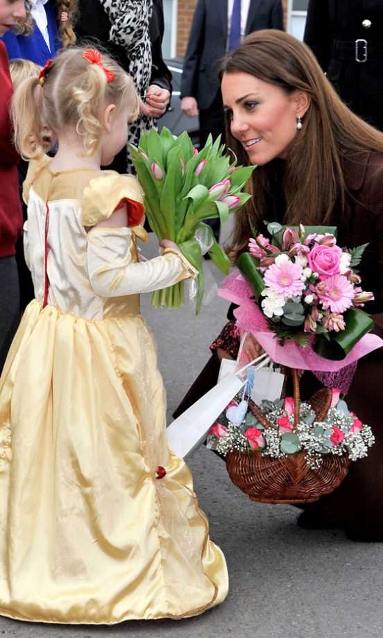 Kate Middleton, Duchess Of Cambridge, With A Child On A Visit To Grimsby, 2013