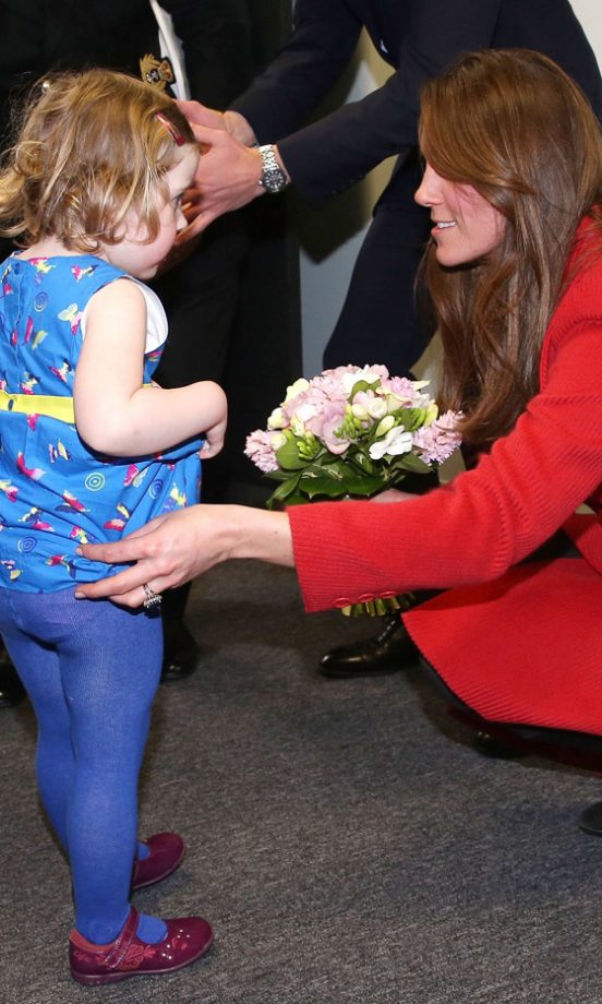 Kate Middleton, Duchess Of Cambridge, With A Child On A Visit To Barrow-In-Furness, 2013