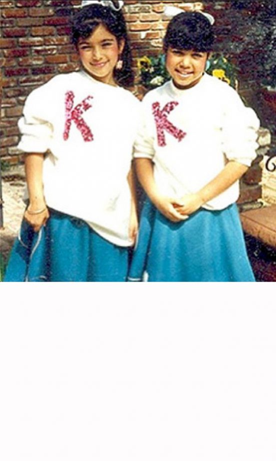 Kim Kardashian And Kourtney Kardashian Play Mini Cheer-Leaders In The Back Garden