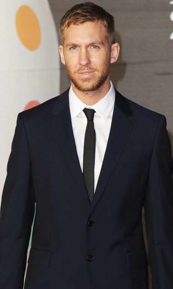Calvin Harris Sizzles With His Blonde 'Do At The Brit Awards, 2013