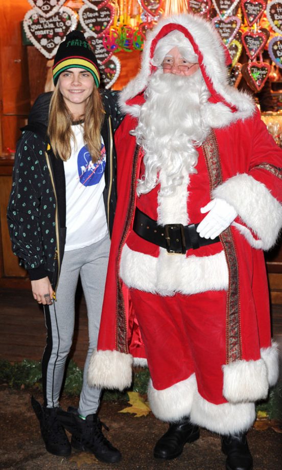 Cara Delevingne Meets The REAL (Ahem) Santa Claus At Winter Wonderland In London, 2013
