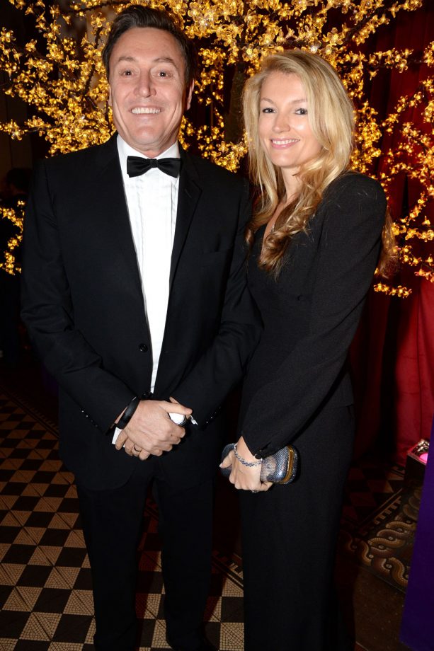 Will Ricker Grins Next To His Date At The Sugarplum Ball In London, 2013