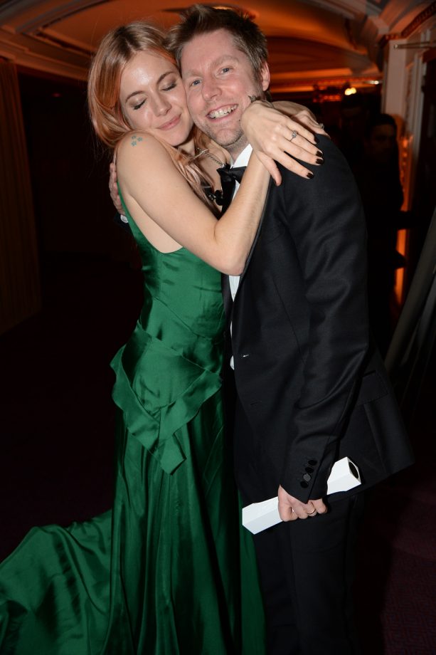 Burberry Model Sienna Miller Cuddles Up To Chief Creative Director Christopher Bailey