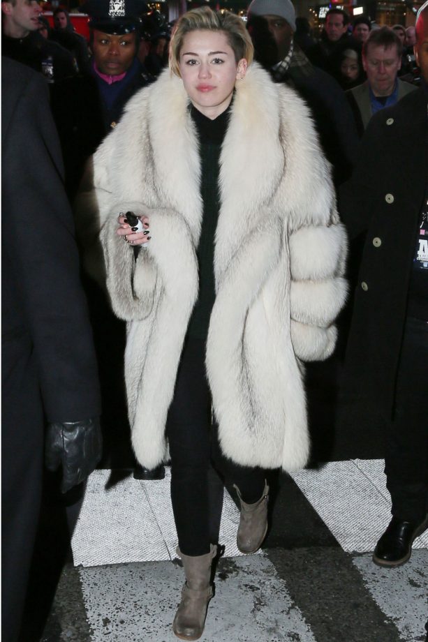 Miley Cyrus Wraps Up In A Giant Coat On New Year, 2013