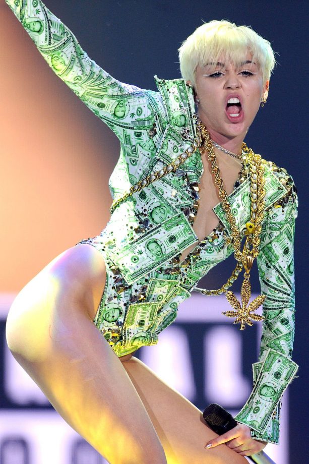 Miley Cyrus Rocks A Dollar Print Costume In Concert At The O2 Arena, London, 2014