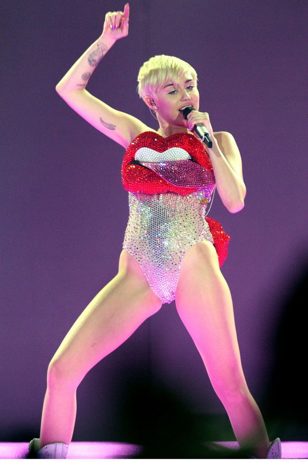 Miley Cyrus Does Big Lips In Costume For Her Concert At The O2 Arena, London, 2014