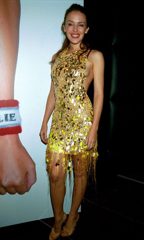 Kylie Minogue Showed Off Her Petite Figure In A Gold Julien MacDonald Dress At Her Book Launch, 1999
