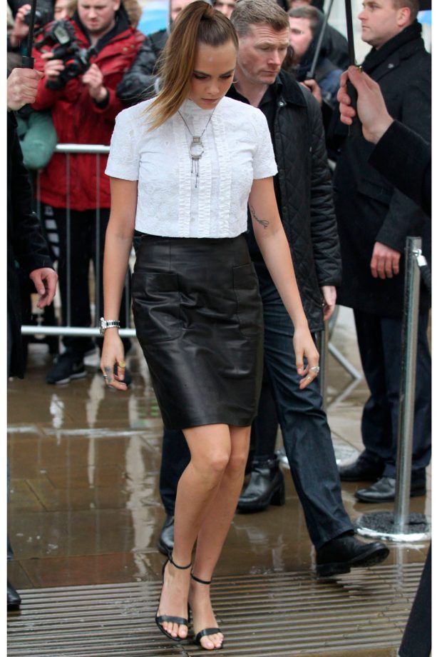 Cara Delevingne In A Leather Skirt And White Embroided Shirt During London Fashion Week, 2015