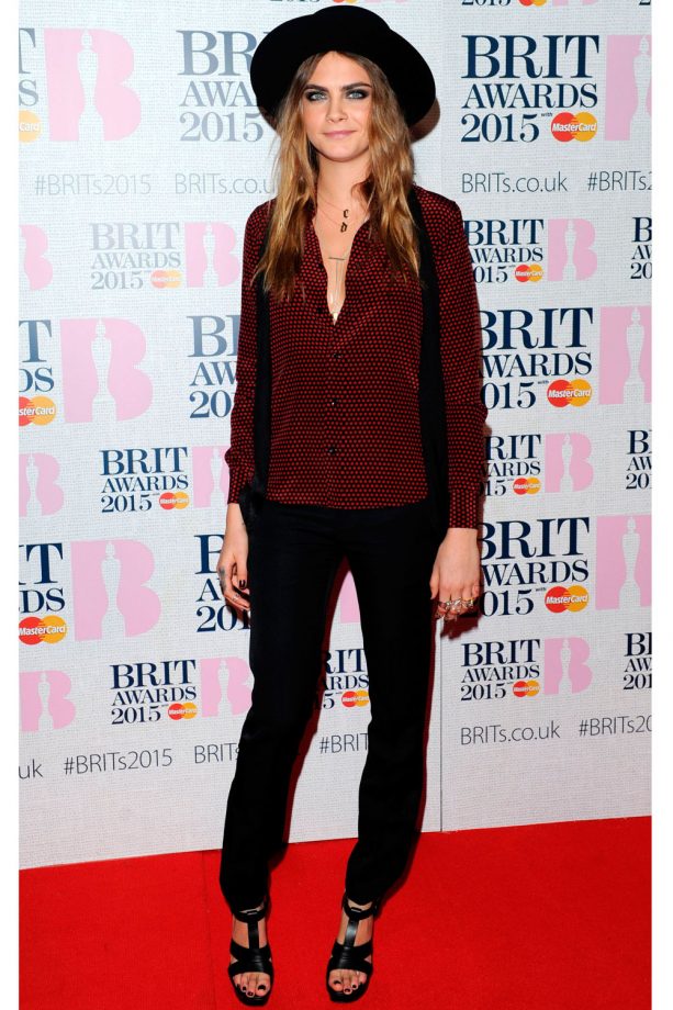 Cara Delevingne Hits The Red Carpet In A Polka Dot Shirt And Wide Rimmed Hat At The Brit Awards, 2015